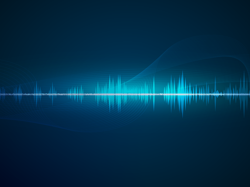 Blue audio waveform on a dark background with abstract wave patterns, representing sound or music visualization.
